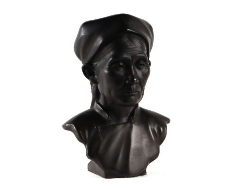 An Indo-Chinese or Vietnamese school bronze bust of an old woman, signed DVCAM, 25cms high