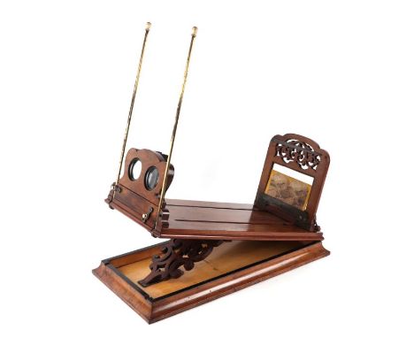 A Victorian figured walnut stereoscopic table top card viewer, 61cms long.Condition ReportGeneral wear, slides ok, no evidenc