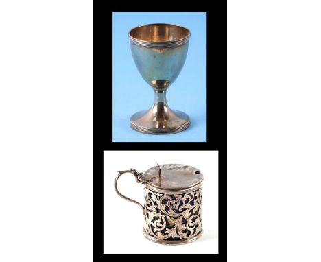 A Victorian silver mustard pot with blue glass liner, Birmingham 1878; together with a Georgian silver egg cup, London 1792 (