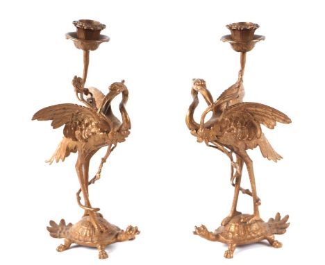 A pair of 19th century French chinoiserie gilt bronze candlesticks in the form of cranes on a minogame (Japanese turtle), 26c