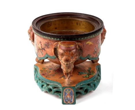 A 19th century Aesthetic Movement Indo-Persian influenced ceramic jardiniere with brass liner, indistinct makers mark impress