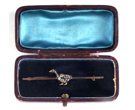 An Edwardian unmarked gold bar brooch with diamond set silver goose with enamel beak, in a leather box, approx 3g.Condition R