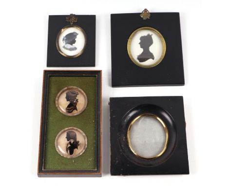 A group of portrait miniature silhouettes; together with a portrait miniature ebonised frame.