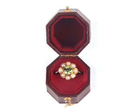 A Victorian 18ct gold peridot and pearl daisy ring, boxed, approx UK size 'N', 3g.
