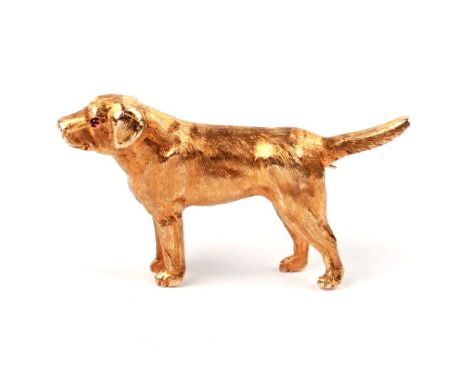 A 9ct gold brooch modelled as a retriever with ruby set eye, 3.5cms long, 8.4g.