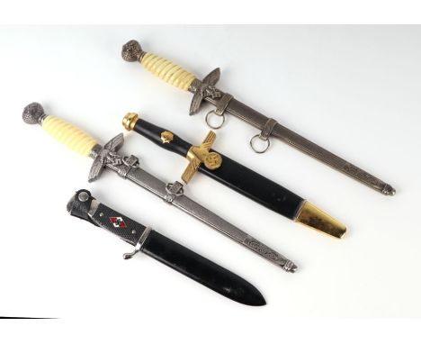 Four replica Nazi dress daggers including Luftwaffe. The Hitler Youth dagger has a blade length of 15.5cms (6.125ins)