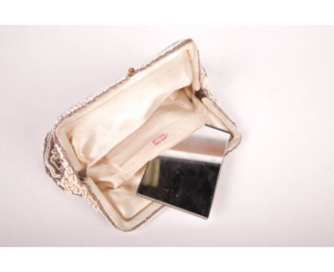 A vintage Belgian beaded purse. With cream silk interior, L18cm