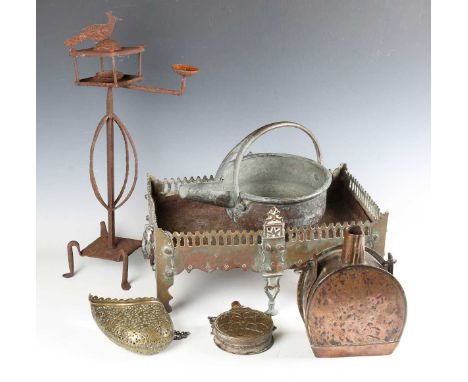 A group of Eastern metalwork, including a Turkish engraved brass powder flask, length 14.5cm, a pierced brass hanging basket 