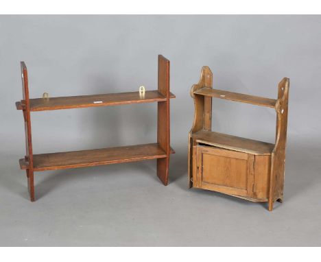 An early 20th century oak two-tier wall shelf with pegged joints, height 61cm, width 64cm, together with a pine wall cabinet.