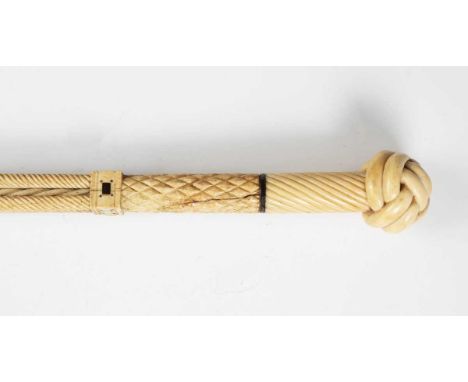 A 19th century scrimshaw whalebone walking cane, the shaft carved with an upper section of architectural spiral reeded pillar