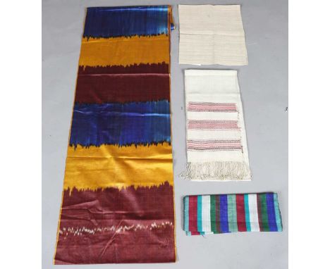 A group of ethnic textiles, including a Burmese sazigyo manuscript binding tape, a Burmese Inle Lake lotus fibre panel, a Bur
