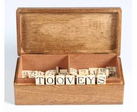 A  group of 19th century bone alphabet tile sets, comprising five alphabets, a set of numbers and others, in a later oak case