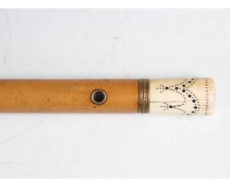 A George III Malacca walking cane, the ivory pommel inlaid with garland dots and dated '1783', length 125cm. Note: a non-tran