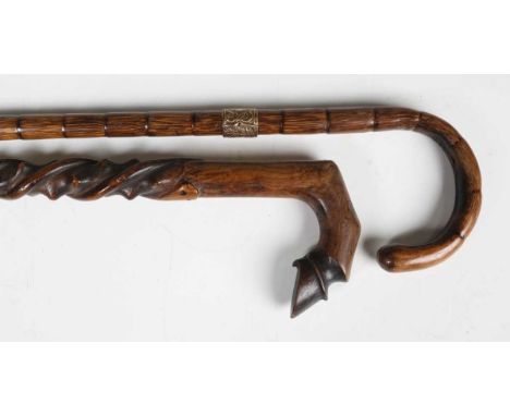 A 19th century yew walking stick, the handle carved as a hoof, length 90cm, together with a 19th century bamboo walking cane 