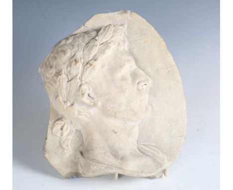 A late 18th century Neoclassical carved white marble plaque, modelled in relief with a profile portrait of a Roman male, widt