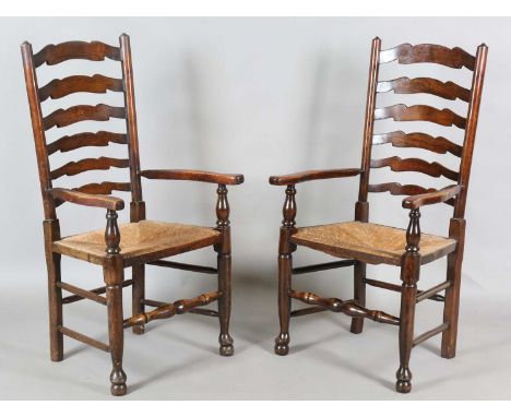 A set of eight 20th century reproduction stained ash ladder back dining chairs, comprising two carvers, height 111cm, width 5