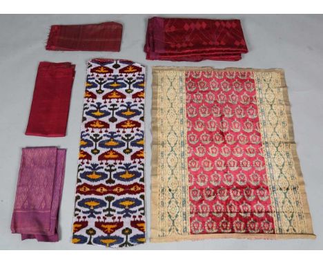 A mixed group of ethnic textiles, including a large Phulkari silk embroidered panel, Northern Pakistan, 222cm x 112cm, a leng