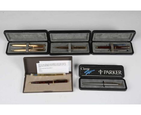 A group of fountain and ballpoint pens, including a Parker gilt metal fountain pen and matching pencil, cased, and another ca