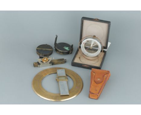 A Small Collection of Surveying Instruments, A Small Collection of Surveying Instruments, a green card prismatic compass/clin