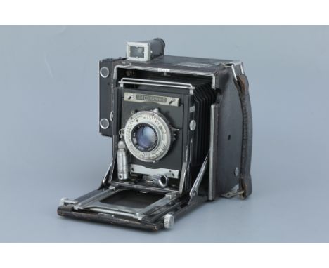 A Graflex Speed Graphic Press Camera, with a Kodak Ektar f/4.7 127mm lens, body, F-G, focal plane shutter working, lens, F-G,