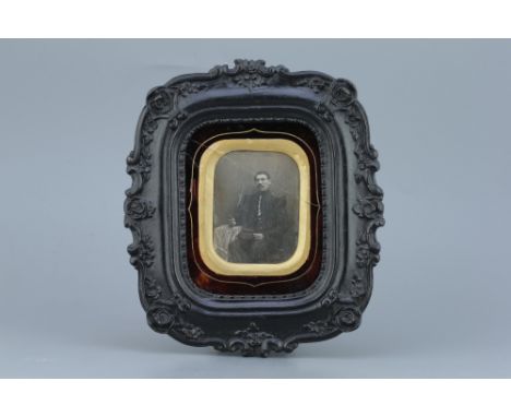 Daguerreotype Portrait of a Soldier, French, c.1840, unmarked, image 9.5cm x 7cm in black painted wooden frame, glass with cr