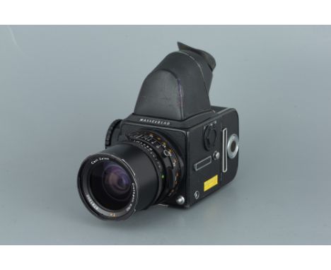 A Hasselblad 500CM Medium Format Camera, black, with Carl Zeiss T* Distagon f/4 50mm lens, black, serial no. 6781200, body, G