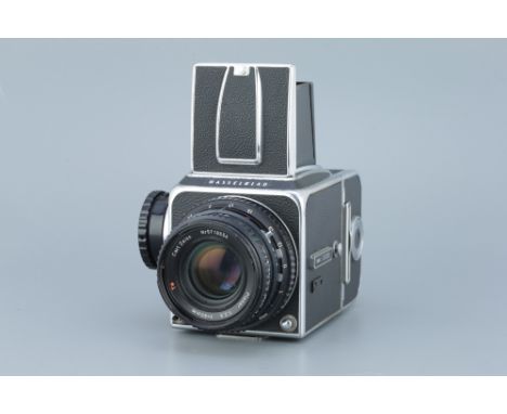 A Hasselblad 500c Medium Format Camera, chrome, serial no. US100153, with Carl Zeiss Planar T* f/2.8 80mm lens, black, serial