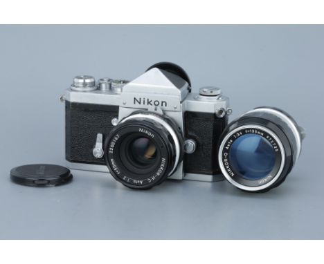 A Nikon F SLR Camera, chrome, serial no. 6704953, with Nikkor-H.C f/2 50mm lens, body, F-G, shutter working, lens, VG, comple