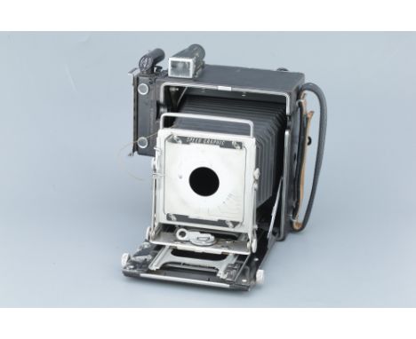 A Graflex Speed Graphic Press Camera, black, serial no. 842132, with a Kalart rangefinder and a 6x7.8 roll film back, body, G