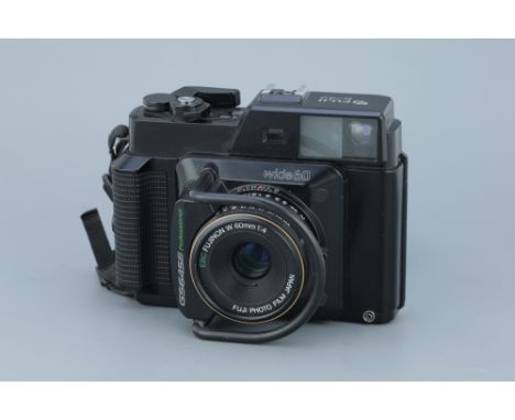 A Fuji GS645S Professional Medium Format Rangefinder Camera, with EBC Fujinon W f/4 60mm lens, body, G-VG, shutter not firing