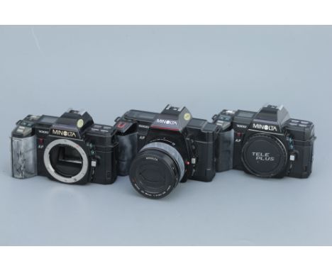 Three Minolta 35mm SLR Cameras, including two Minolta 7000 AF (Maxxum 7000) bodies, and a Minolta 5000 AF (Maxxum 5000) with 