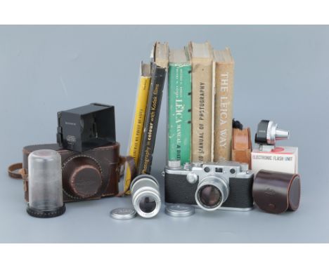 A Leica IIIf Rangefinder Camera, chrome, serial no. 630220, with Leitz Summicron f/2 50mm lens, chrome, serial no. 1041784, b