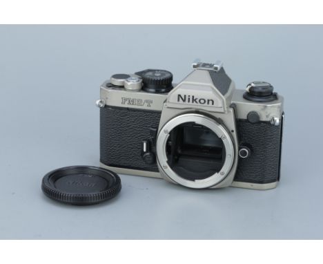 A Nikon FM2/T Titanium SLR Body, serial no. 9004931, body, P-F, shutter fires but damage to curtain