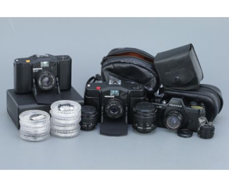 A Selection of Miniature Cameras, including two Pentax 110 SLRs with a selection of lenses, a Minox 35 GT, and a Minox 35 EL,
