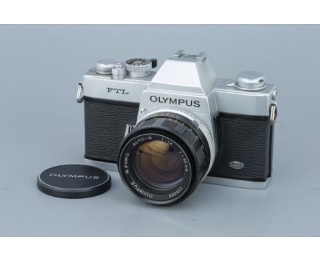 An Olympus FTL SLR Camera, with G.Zuiko f/1.4 50mm lens, body, G-VG, mirror stuck up, lens, G, some light internal haze