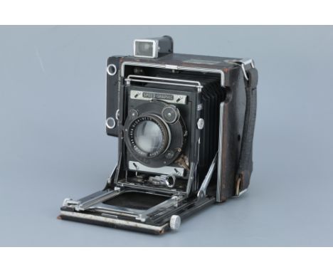 A Graflex Speed Graphic Press Camera, black, 4x5, with a Carl Zeiss Jena Tessar f/3.5 135mm lens, body, G, slight peeling of 