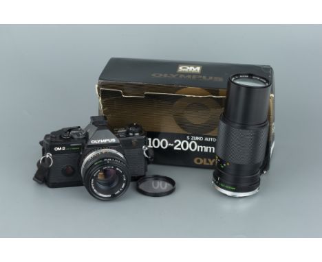 An Olympus OM-2 Spot SLR Camera, with Zuiko. f/1.8 50mm lens, body, G, shutter requires attention, lens, G, some very light f