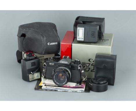 A Canon EF SLR Camera, black, with Canon FD S.C. f/1.8 50mm lens, body, VG, lens, VG, in maker's box