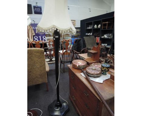 A standard lamp and shade