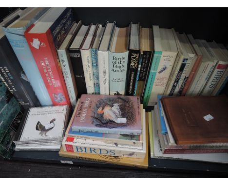A shelf of books including ornithological 