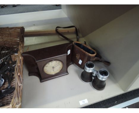 A Bakelite mantel clock, Ferranti, and a cased pair of French opera glasses, Lemaire