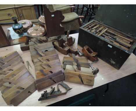 A wooden tool box containing vintage chisel set named 'L Lambert' and a large box of vintage tools