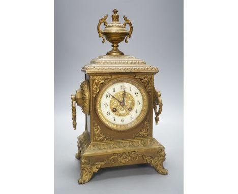 An early 20th century brass mantel clock, 40 cms high.