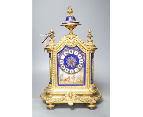A 19th century French ormolu cased mantel clock, with decorated porcelain panels and face, eight day movement with strike, 40