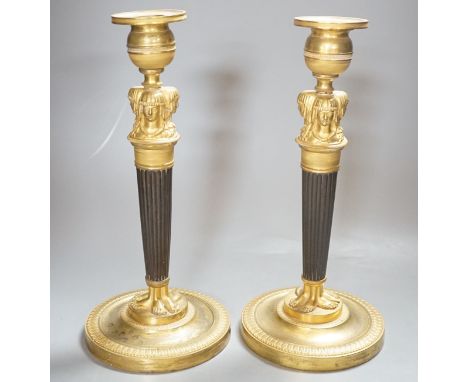 A pair of Empire style bronze and ormolu candlesticks - 29.5cm tall