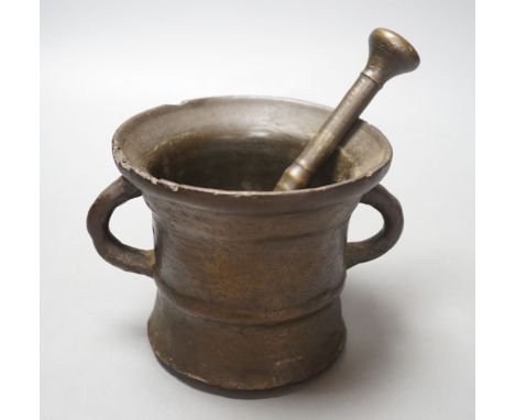 An 18th century bronze pestle and mortar