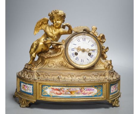 A French ormolu and Sevres style porcelain mounted putti mantel clock by Le Roy et Fils, Palais Royale, Paris, 26 cms high.