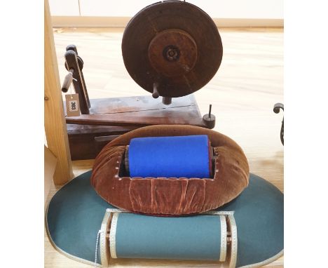 An antique lacemaker's pillow and a modern lacemaker's pillow and a lacemaker's bobbin winder