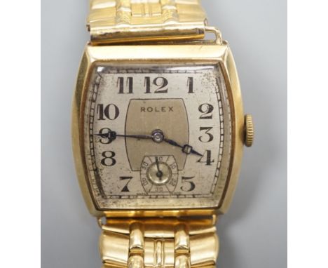 A gentleman's early 1930's 9ct gold Rolex manual wind wrist watch, with tonneau shaped case and Arabic dial with subsidiary s
