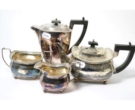 A silver four piece tea service, Birmingham 1940 and the hot water jug 1966, comprising teapot, hot water jug, cream jug and 